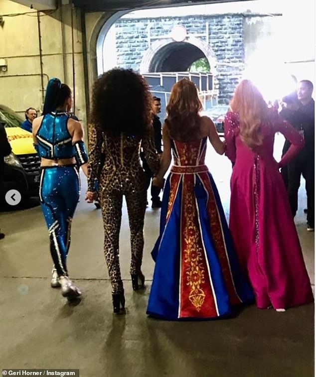 United: Ginger Spice shared a snap of herself on stage clad in a red and blue Renaissance-style gown and a shot of herself backstage walking hand-in-hand with her bandmates