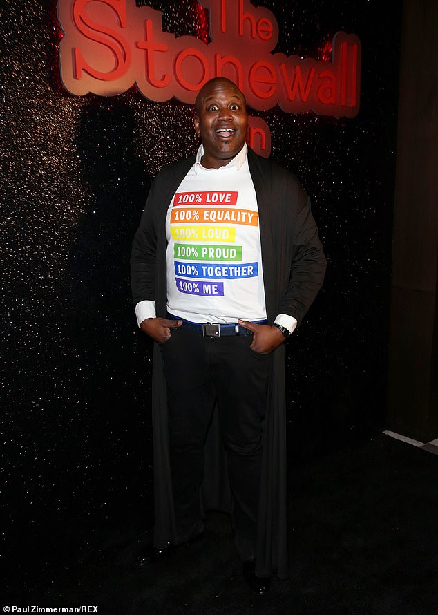 'Loud': Also gracing the red carpet at the A-list event was Tituss Burgess, who wore a long black coat over a statement T-shirt