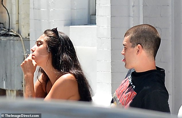 Smoke break: Madonna's daughter, Lourdes Leon, 22, was seen enjoying a smoke break while out and about with her mystery boyfriend in New York City on Monday