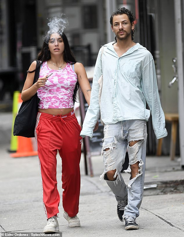 Carefree: Madonna's daughter Lourdes Leon showed a similar flare for fashion as the Material Girl when she stepped out with a mystery man in Chinatown neighborhood of New York City