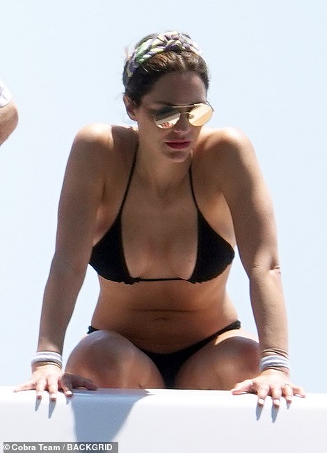 Wow: The singer exhibited her enviable frame in a busty black string bikini as she joined David for an idyllic yacht trip in Capri