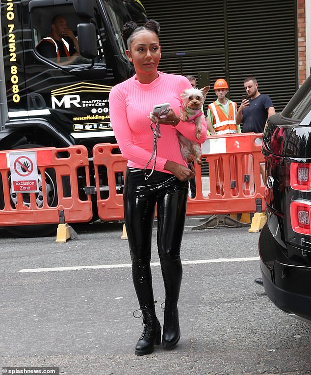 Centre of attention: Mel was besieged by fans as she arrived at the studios