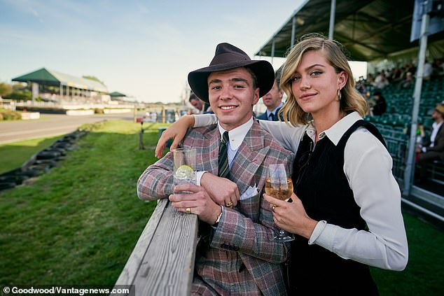 Cheers: The pair appeared in high-spirits as they smiled for pictures and sipped on refreshing looking drinks