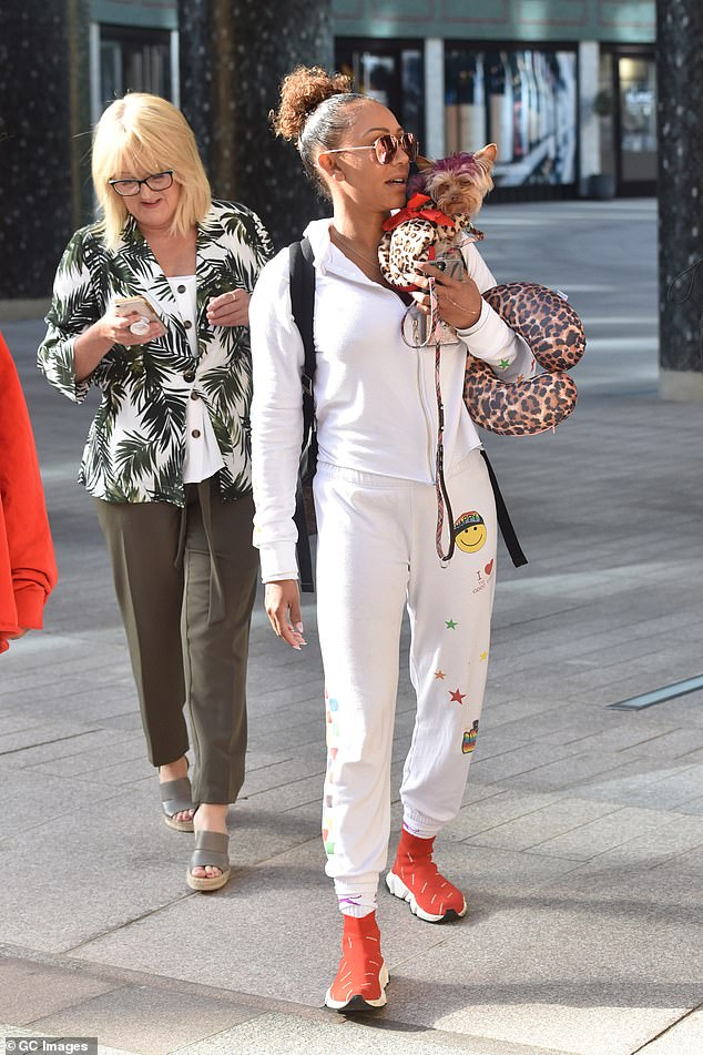 Just like Mel! Her beloved dog Cookie had endured a Scary Spice approved makeover complete with purple quiff and leopard print coat