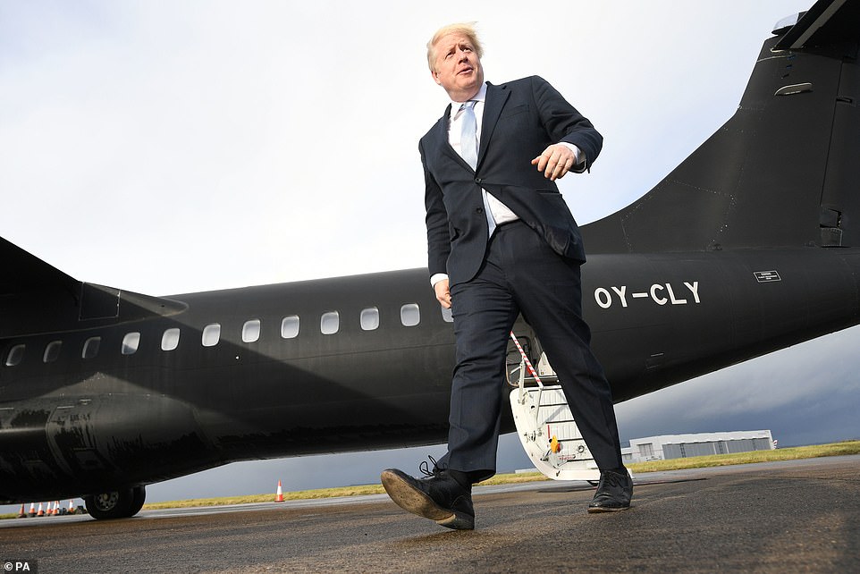 Boris Johnson arrives at Cardiff airport ahead of a visit to IG Design Group in Hengoed, Wales. The PM has come under fire from environmentalists and political rivals for his use of short haul flights this election