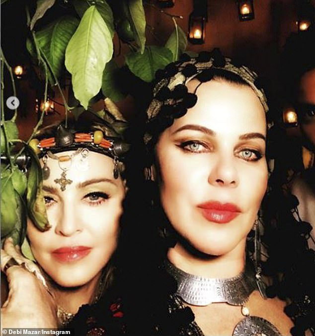 Insider info: For the first time, Younger actress Debi Mazar (R) weighed in on her longtime best friend Madonna's (L) latest relationship with back-up dancer Ahlamalik Williams, who's 36 years her junior (pictured in 2018)