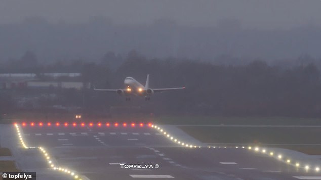 The pilot raises the plane after the failed landing attempt during the tricky weather conditions