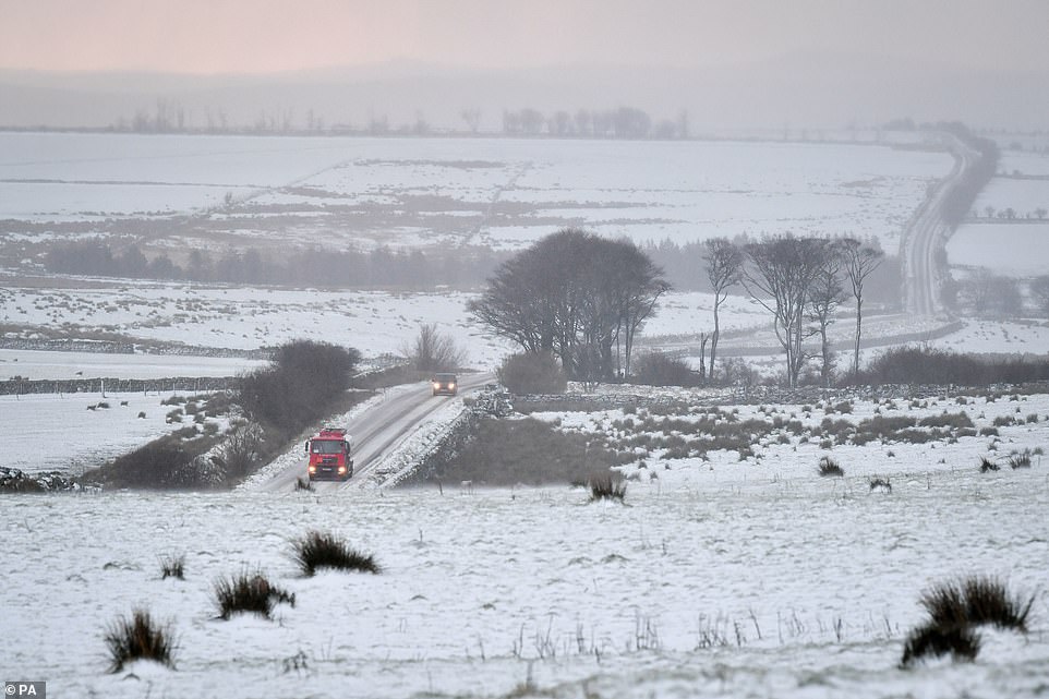 Snow on fields and roads around Princetown on the top of Dartmoor, Devon, where snow has fallen on high ground