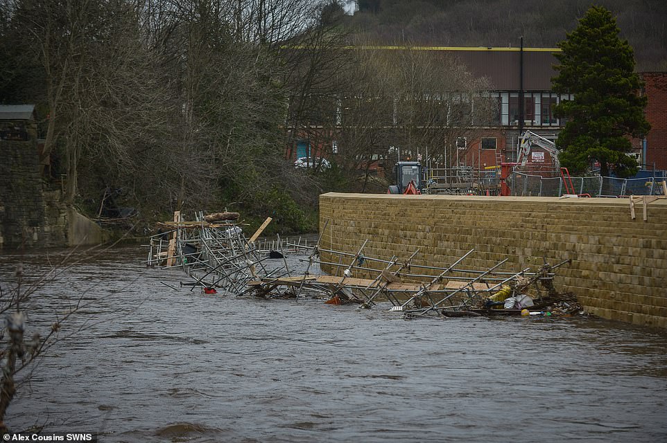 Incomplete flood defences in Mytholmroyd near Halifax. Residents and businesses are upset at the continual flooding in the area