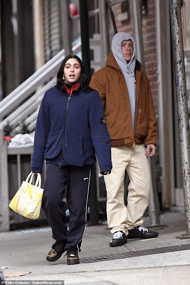 Shooting hoops: She contrasted the laid-back look with a pair of gold hoop earrings, injecting a sense of glamour to the otherwise dressed down style