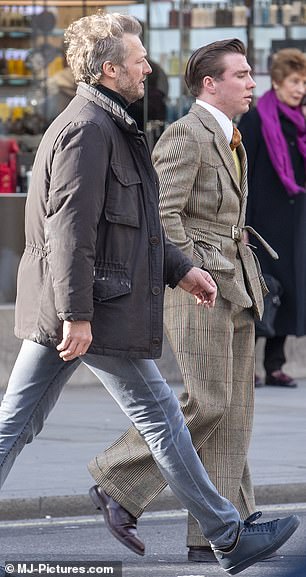 All in the details: Rocco rounded out his ensemble with a crisp white shirt and burnt orange tie