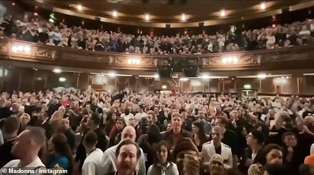 Loving life: The singer's fans looked delighted as she burst through the curtain to keep performing, despite the fact she'd been cut off