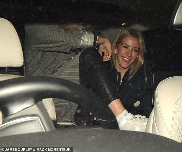 Giggles: The musician, 33, was in a very chipper mood as she and her pals piled into the back of a car after watching the Queen of Pop, 61, perform