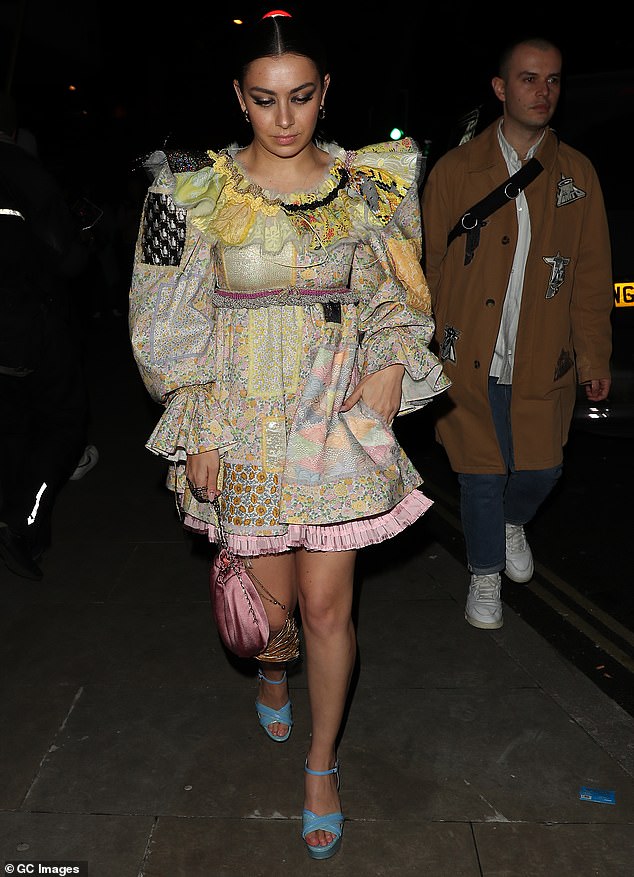 Party time: She slicked back her shiny raven locks into a low bun for the event sponsored by CÎROC