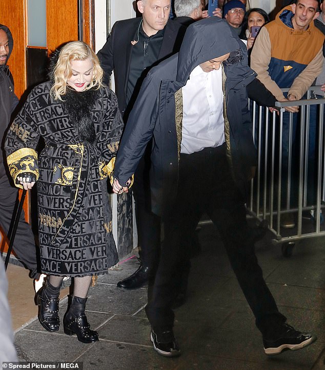 Romantic: Madonna, 61, stepped out on Saturday night at the Grand Rex in Paris after her performance with her toyboy beau Ahlamalik Williams, 25,