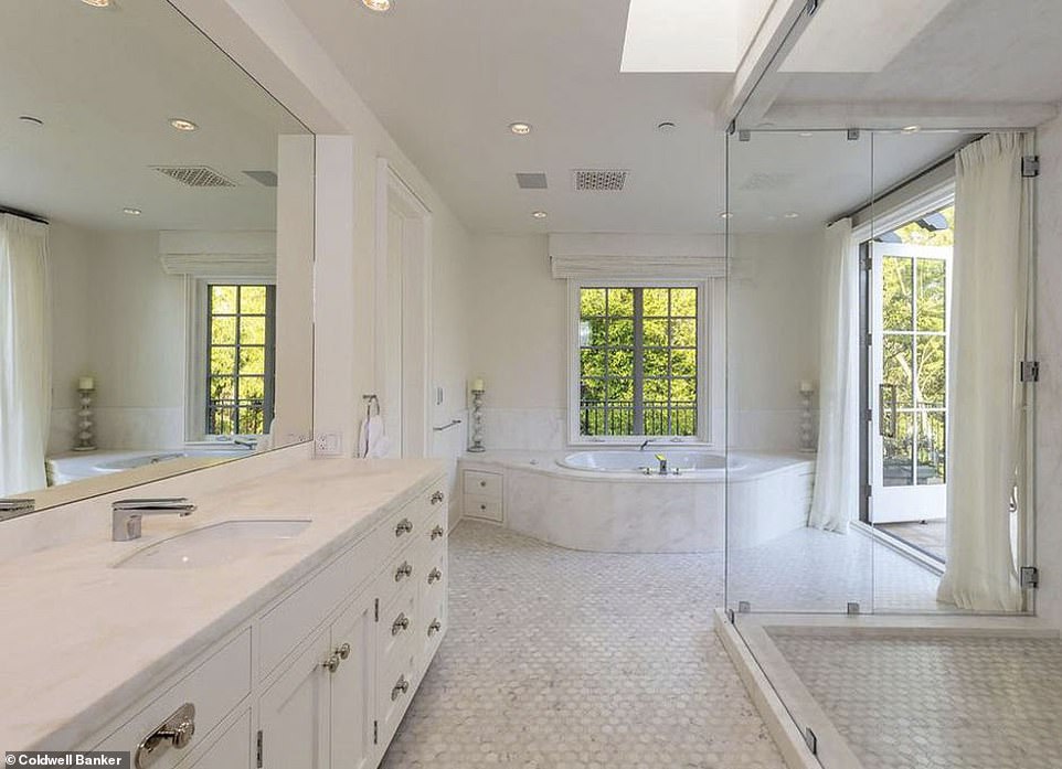 Stunning:  The bathroom is complete with standing shower and large tub