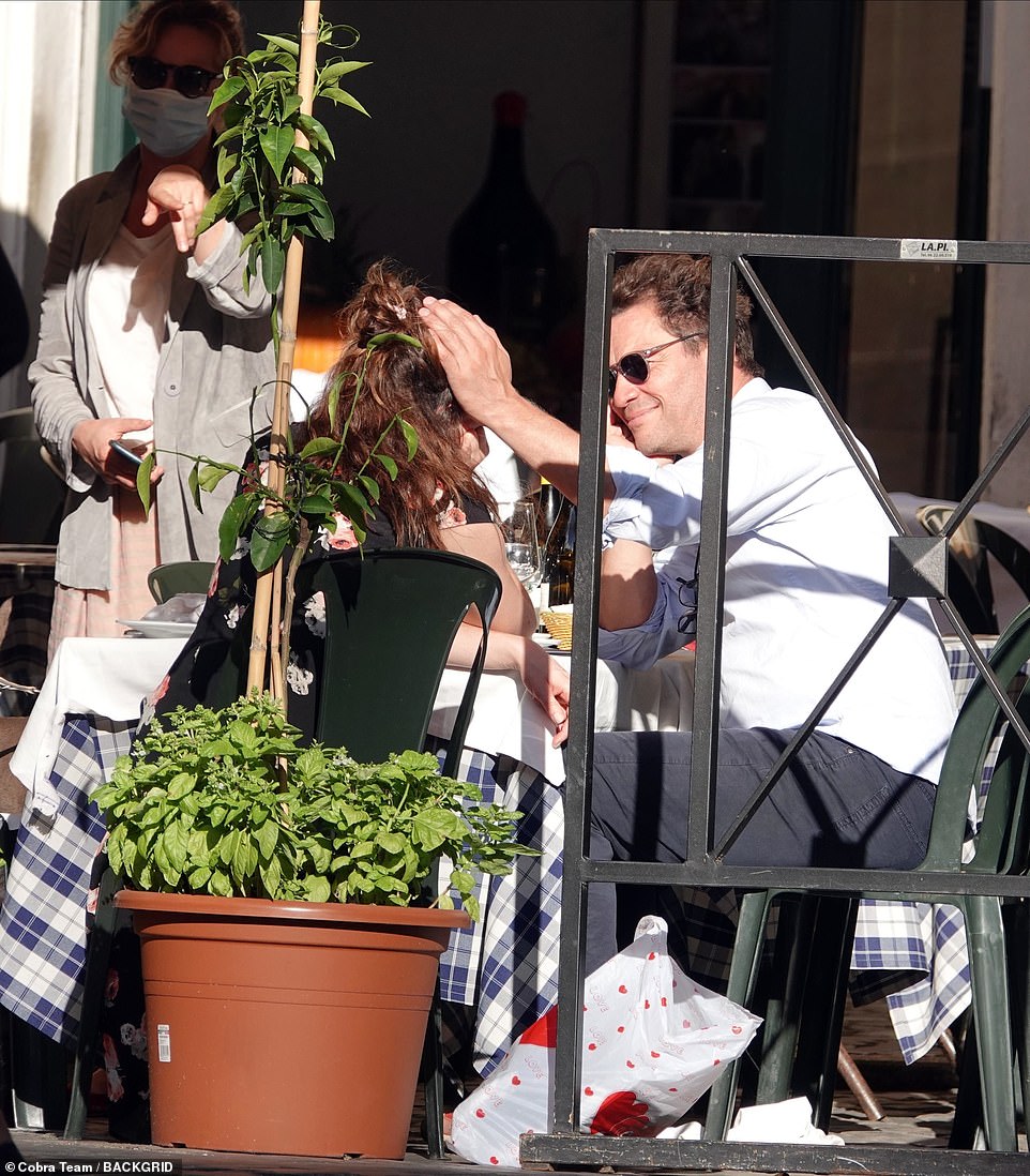 Close: At the end of lunch Lily sat next to Dominic and he couldn't resist kissing her neck and stroking her as he displayed his wedding ring free hand