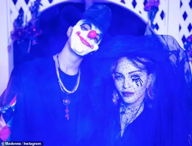 Clowning around: Ahlamalik kept it creepy in a rubber clown mask, which he wore with a tall black mountain hat and a cool black suit