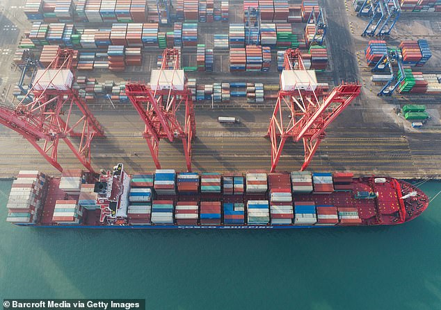 A container ship prepares to leave a port terminal at Lianyungang today as China hailed its trade success during the year of coronavirus