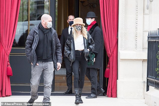 Ready to work: She completed her look with lace-up biker boots as she headed to work