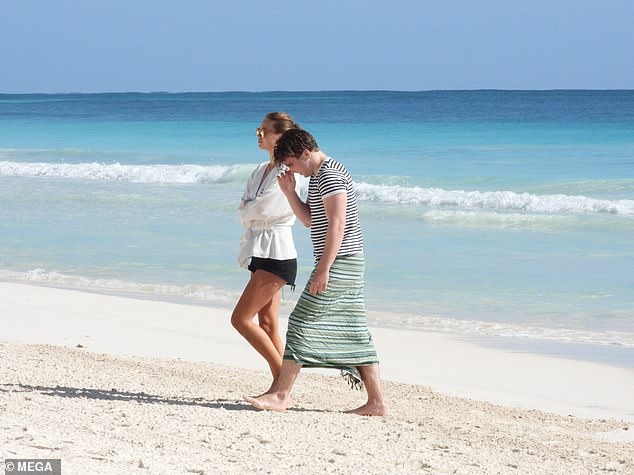 Stripy: Rocco arrived in a nautical striped T-shirt and navy board shorts