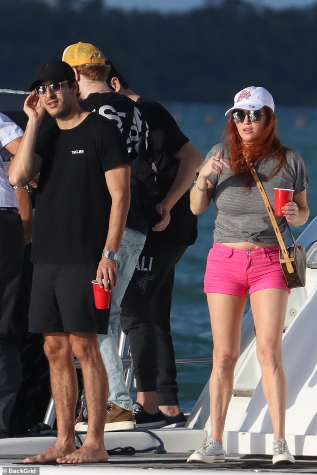 Day out: Tamara looked to be having a great time as she larked about on the deck of the luxury vessel with her daughter who wore a flattering purple string bikini