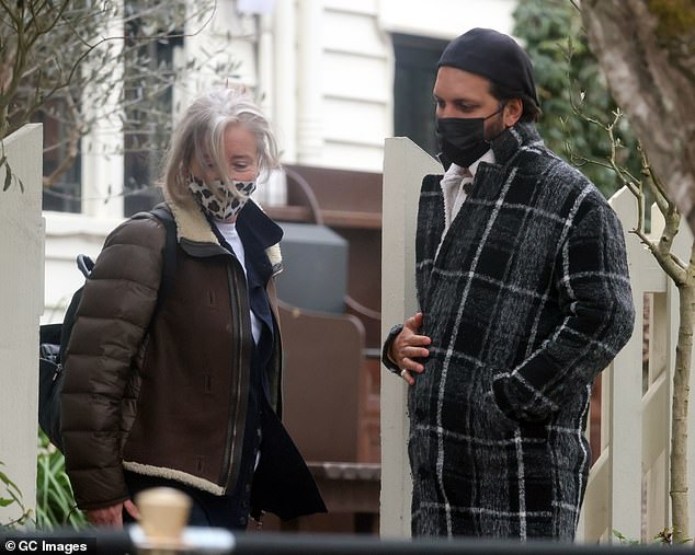 Make-up free: The Academy Award-winning actress appeared to go make-up free for the outing and wore her hair swept up into a bun