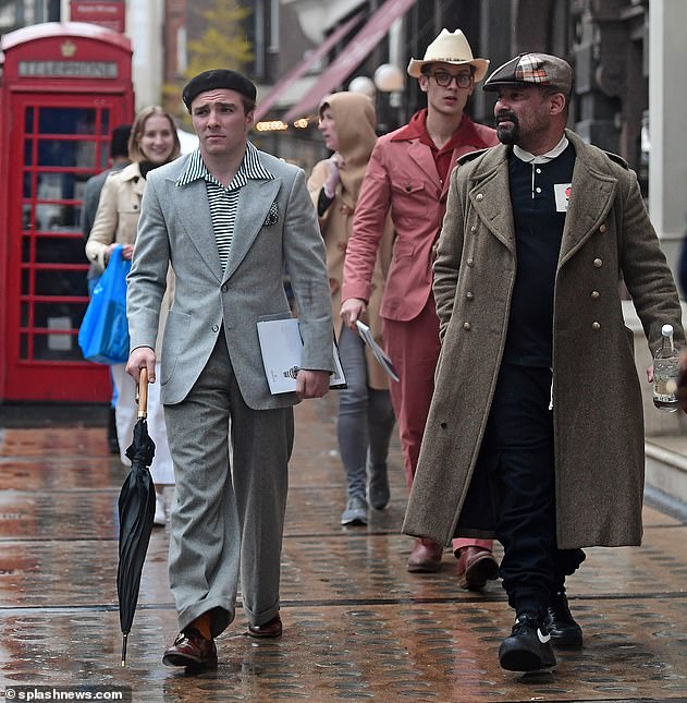 Style: Ritchie was joined by two other smart looking men one of whom was photographer Arnaldo Anaya-Lucca