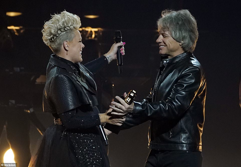 First crush: The performance was introduced by the singer's first crush, Jon Bon Jovi, who he's since become close friends with, though Pink made it clear she was 'crushed' upon learning the Bon Jovi frontman was married