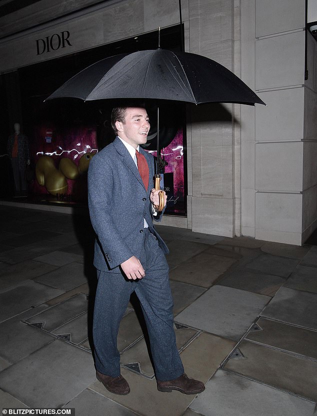 Stylish: The son of Madonna and Guy Ritchie  looked timelessly chic as he donned the vintage ensemble and accessorised with a red tie and matching pocket square