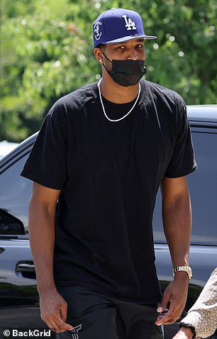 Doting: Khloe Kardashian and her on-again beau Tristan Thompson looked every bit the doting parents on Thursday afternoon