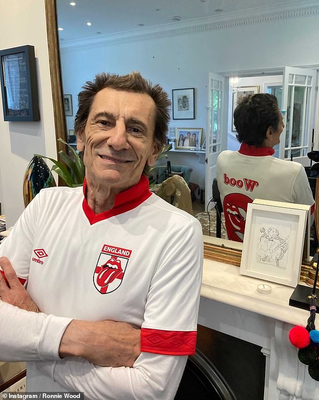 Getting in the mood! Rolling Stones' Ronnie Wood shared a pair of snaps in a specially-made England shirt ahead of the match