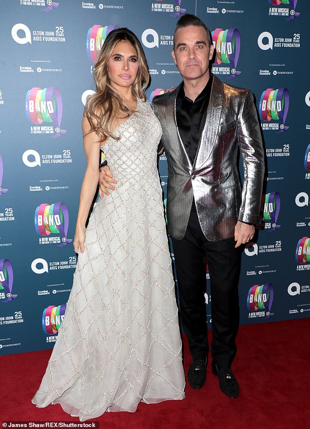 Life onscreen: Robbie is set to start working on his biopic in Australia in early 2022, according to reports, and will relocate to Australia where it's being filmed (pictured above with Ayda in 2018)