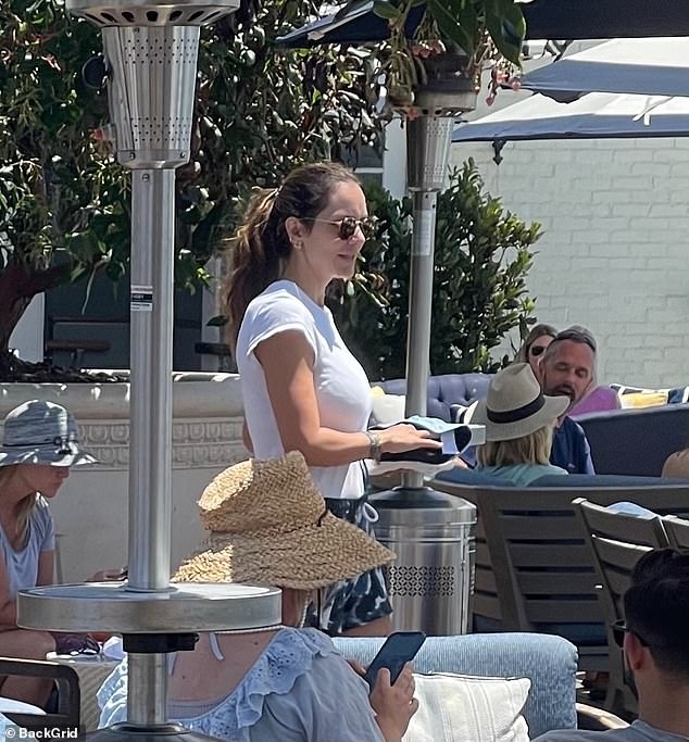 Out and about: Katharine McPhee was overjoyed to be spending time with her family as she dined al fresco with husband David Foster and their six-month-old son Rennie