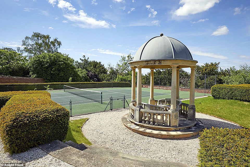 Serene: The property boasts a walled garden with a pavilion, a tennis court, and paddocks for horses