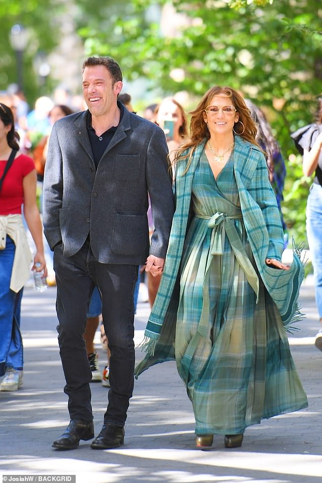 The latest: Jennifer Lopez, 52,  and Ben Affleck, 49,  shared a bit of PDA as they stepped out in New York City Sunday, following her declaration that she had 'love on the brain' in her concert last night