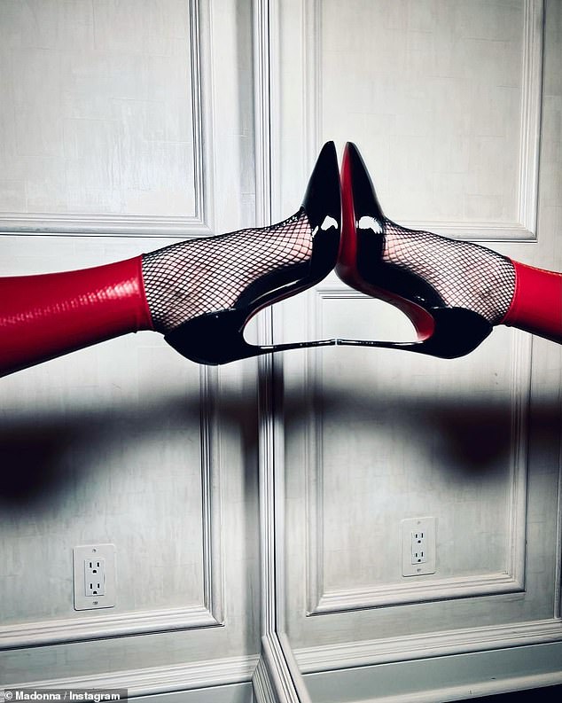 Well-heeled: The black and red combination has been a common theme in her fashion choices and promotional writings since she dropped her Madame X studio album in June 2019