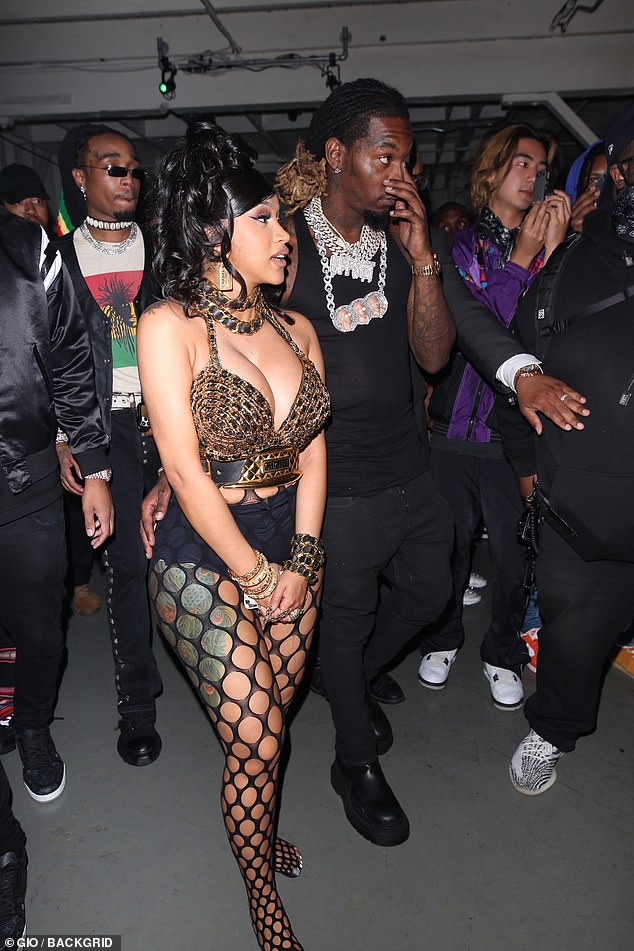 Unique style: Cardi wore some black underwear beneath her tights and opted to go shoeless at the venue