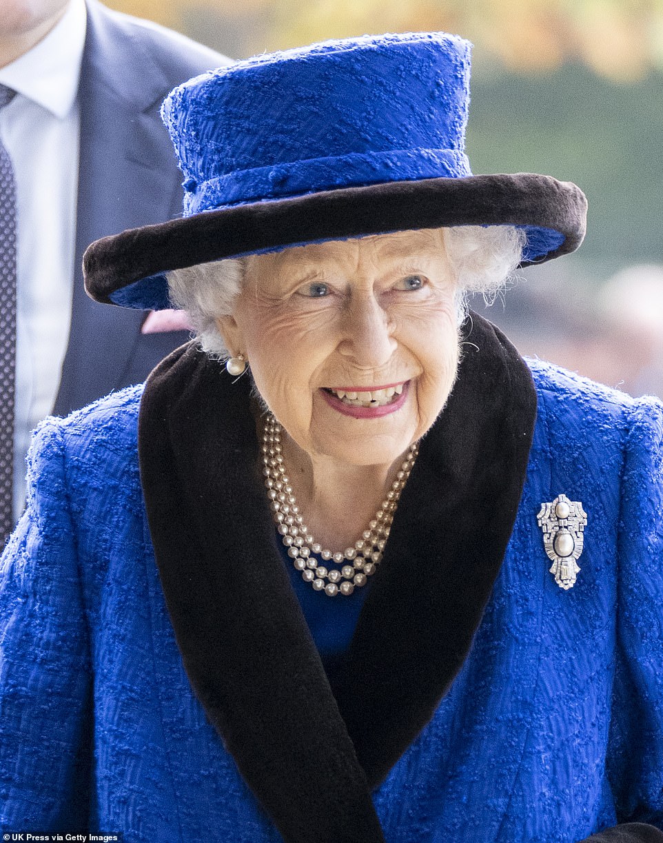 All smiles: The Queen couldn't keep the grin off her face when attending today's racing