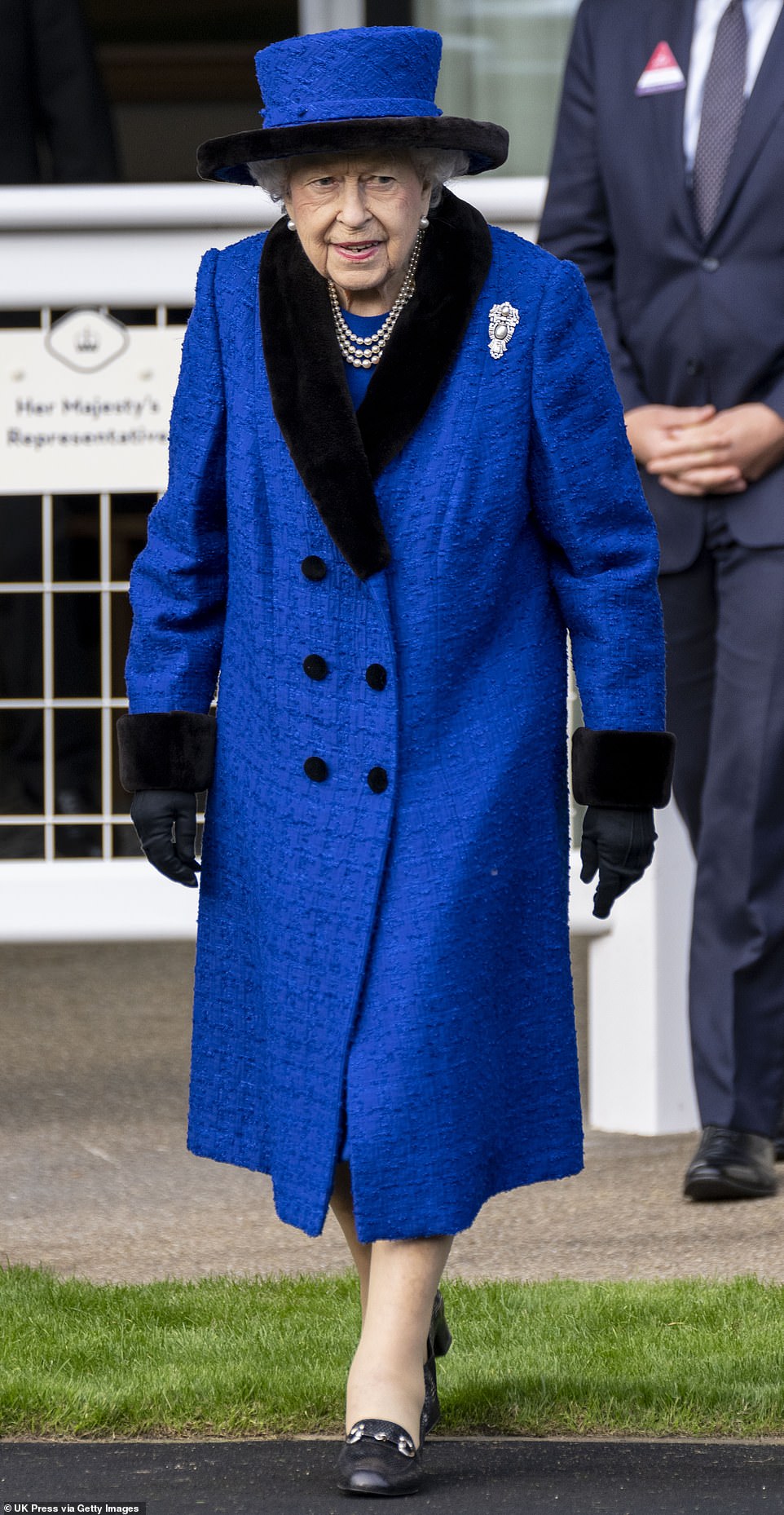 The Queen stepping out at the event, pictured