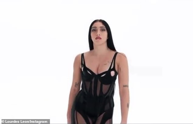 Fierce: While turning up the heat in her dominatrix-inspired ensemble for a Mugler campaign, Madonna's daughter, 25, stood proudly with both hands on her hips as she smoldered at the camera