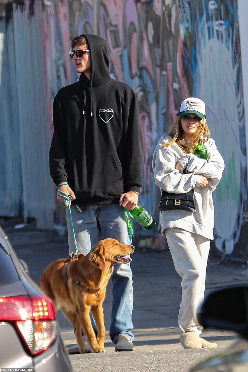 Hitting their stride: Olivia wore fluffy slippers while Jacob opted for suede shoes