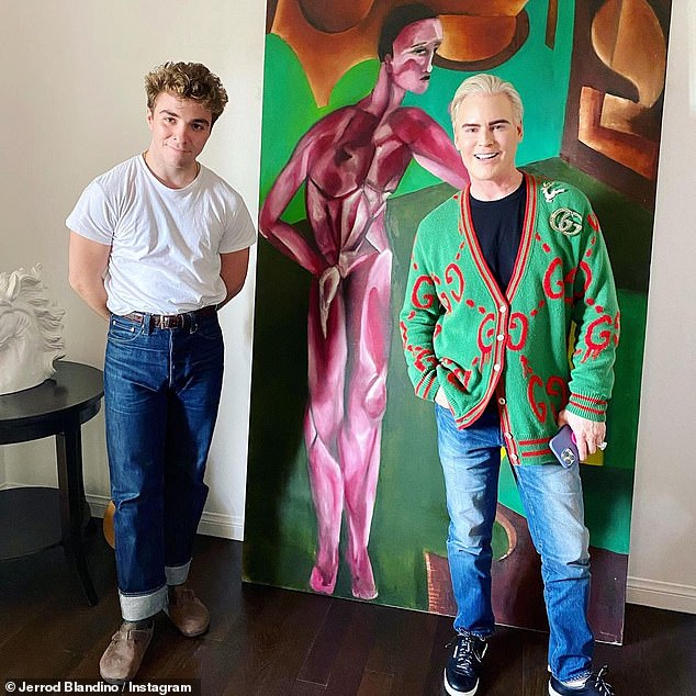 'This kid is shaking things up': Madonna shares Rocco with ex-husband Guy Ritchie, and her eldest son has quietly established himself as an expressionist painter under the name 'Rhed' (pictured with buyer Jerrod Blandino on December 15)