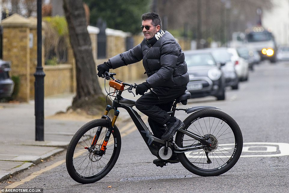 Better safe than sorry: Simon (pictured riding his bike last month)  has since promised to stay away from bikes for good after the 'horror' crash