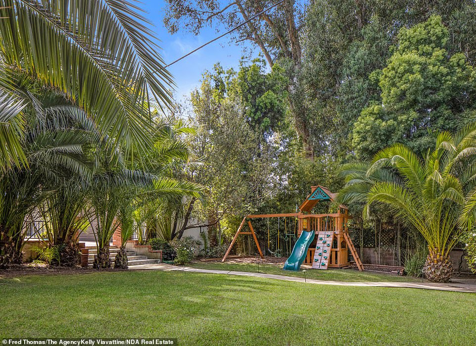 As for the outdoors, a courtyard is ideal for al fresco dining with a built-in barbecue and fireplace, and an open-air pavilion holds a fireside lounge area. There¿s also a lush tree-lined backyard hosting a grassy lawn with a playground set and plenty of room for a pool.