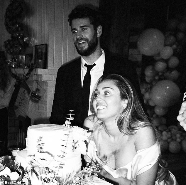 No wedded bliss: Miley Cyrus admitted on a concert stage in Brazil her marriage to actor Liam Hemsworth was 'a f****** disaster' right after helping a couple come on stage and get engaged