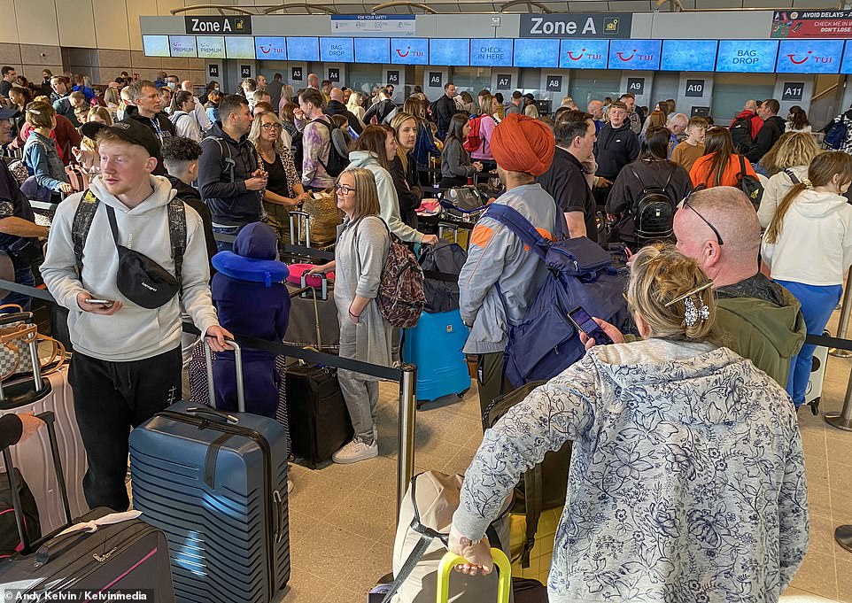 Pictured: Despite pleas from airport bosses to arrive three hours before flights, large queues are seen at the airport check-in at Manchester Airport on Saturday April 9