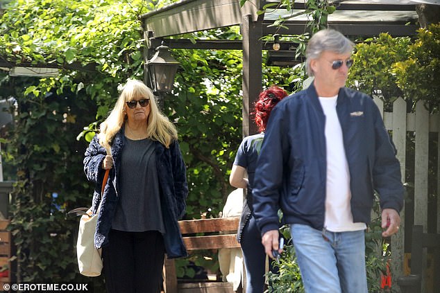 Bank holiday activity: Richard was looking smart in jeans and a navy blue jacket as he led the way to the couple's car after lunch