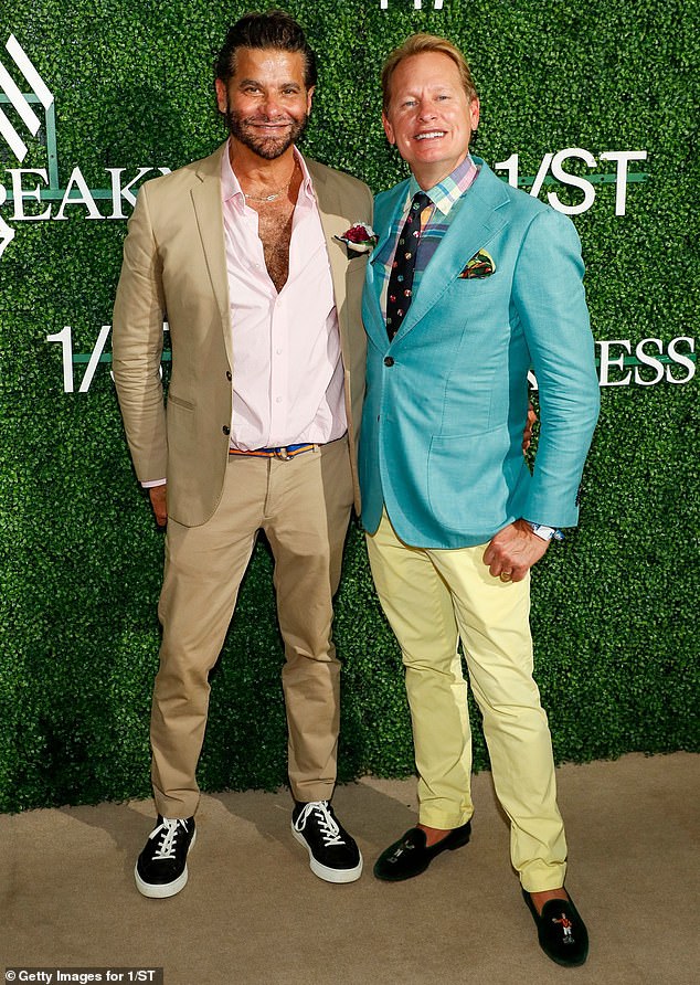 Two of a kind: John Guerrera opted for a dark beige shirt and a matching set of pants, and he contrasted his clothing with a pair of dual-tone sneakers while Carson Kressley stood out while wearing a turquoise-colored jacket