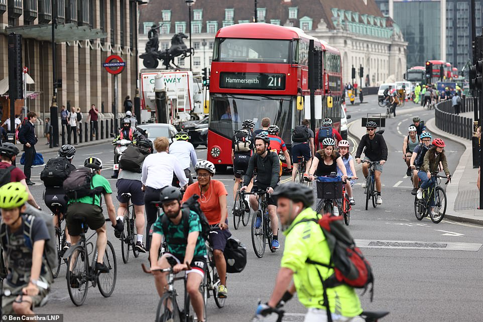 WESTMINSTER: Commuters cycle through Parliament Square in Westminster on their way to work today